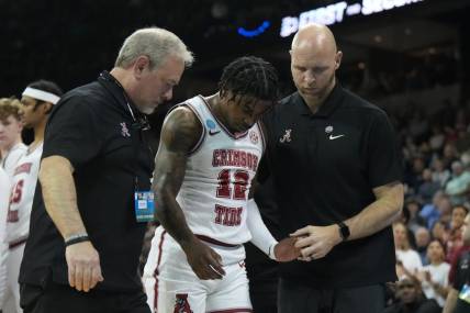 Mar 24, 2024; Spokane, WA, USA; Alabama Crimson Tide guard Latrell Wrightsell Jr. (12) is attended to by official in the first half against the Grand Canyon Antelopes at Spokane Veterans Memorial Arena. Mandatory Credit: Kirby Lee-USA TODAY Sports