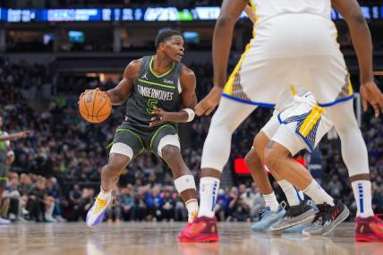 Mar 24, 2024; Minneapolis, Minnesota, USA; Minnesota Timberwolves guard Anthony Edwards (5) dribbles against the Golden State Warriors in the second quarter at Target Center. Mandatory Credit: Brad Rempel-USA TODAY Sports