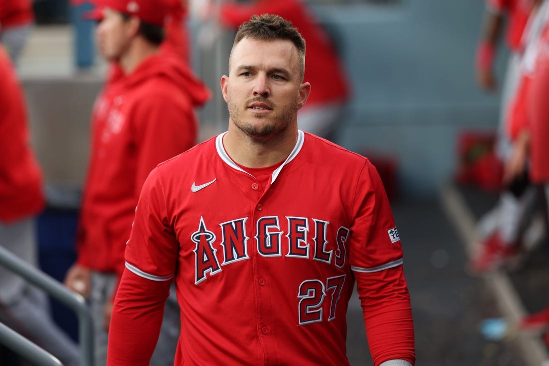 Mar 24, 2024; Los Angeles, California, USA; Los Angeles Angels center fielder Mike Trout (27) walks in the dugout during the game against the Los Angeles Dodgers at Dodger Stadium. Mandatory Credit: Kiyoshi Mio-USA TODAY Sports
