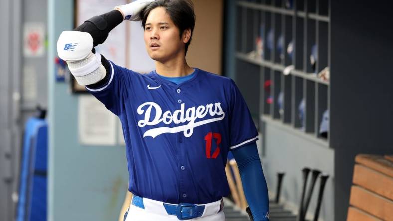 Mar 24, 2024; Los Angeles, California, USA;  Los Angeles Dodgers designated hitter Shohei Ohtani (17) in the dugout prior to the game against the Los Angeles Angels at Dodger Stadium. Mandatory Credit: Kiyoshi Mio-USA TODAY Sports