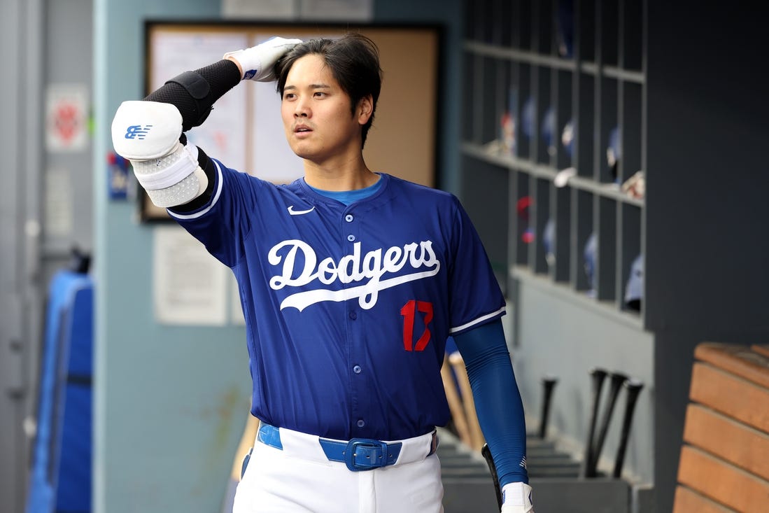 Mar 24, 2024; Los Angeles, California, USA;  Los Angeles Dodgers designated hitter Shohei Ohtani (17) in the dugout prior to the game against the Los Angeles Angels at Dodger Stadium. Mandatory Credit: Kiyoshi Mio-USA TODAY Sports