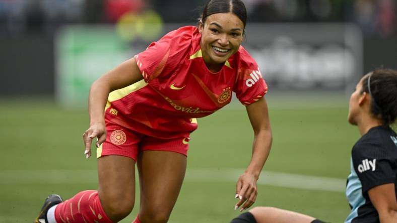 Mar 24, 2024; Portland, Oregon, USA; Portland Thorns FC forward Sophia Smith (9) smiles during the first half against NJ/NY Gotham FC at Providence Park. Mandatory Credit: Troy Wayrynen-USA TODAY Sports