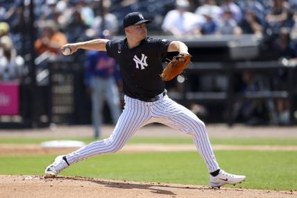 Mar 25, 2024; Tampa, Florida, USA;  New York Yankees starting pitcher Clarke Schmidt (36) throws a pitch against the New York Mets in the first inning at George M. Steinbrenner Field. Mandatory Credit: Nathan Ray Seebeck-USA TODAY Sports