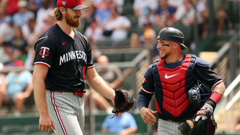 Mar 25, 2024; North Port, Florida, USA;  Minnesota Twins starting pitcher Bailey Ober (17) and catcher Christian Vazquez (8) smile at the end of the fourth inning against the Atlanta Braves at CoolToday Park. Mandatory Credit: Kim Klement Neitzel-USA TODAY Sports