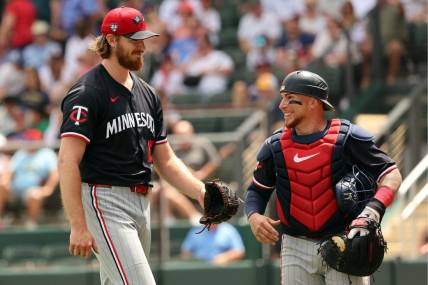 Mar 25, 2024; North Port, Florida, USA;  Minnesota Twins starting pitcher Bailey Ober (17) and catcher Christian Vazquez (8) smile at the end of the fourth inning against the Atlanta Braves at CoolToday Park. Mandatory Credit: Kim Klement Neitzel-USA TODAY Sports