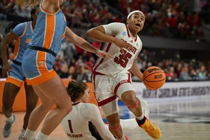 Mar 25, 2024; Raleigh, North Carolina, USA; NC State Wolfpack guard Zoe Brooks (35) drives past Tennessee Lady Vols guard Sara Puckett (1) in the second round of the 2024 NCAA Women's Tournament at James T. Valvano Arena at William Neal Reynolds. Mandatory Credit: William Howard-USA TODAY Sports