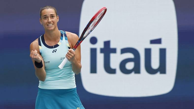 Mar 25, 2024; Miami Gardens, FL, USA; Caroline Garcia (FRA) celebrates after match point against Coco Gauff (USA) (not pictured) on day eight of the Miami Open at Hard Rock Stadium. Mandatory Credit: Geoff Burke-USA TODAY Sports