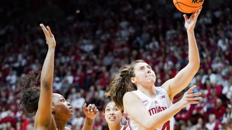 Indiana Hoosiers forward Mackenzie Holmes (54) scores the ball during the NCAA tournament second round game against the Oklahoma Sooners at Simon Skjodt Assembly Hall on Monday, March 25, 2024.