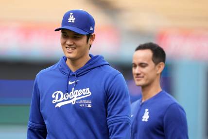 Mar 25, 2024; Los Angeles, California, USA; Los Angeles Dodgers designated hitter Shohei Ohtani (left) and interpreter Will Ireton before the game against the Los Angeles Angels at Dodger Stadium. Mandatory Credit: Kirby Lee-USA TODAY Sports