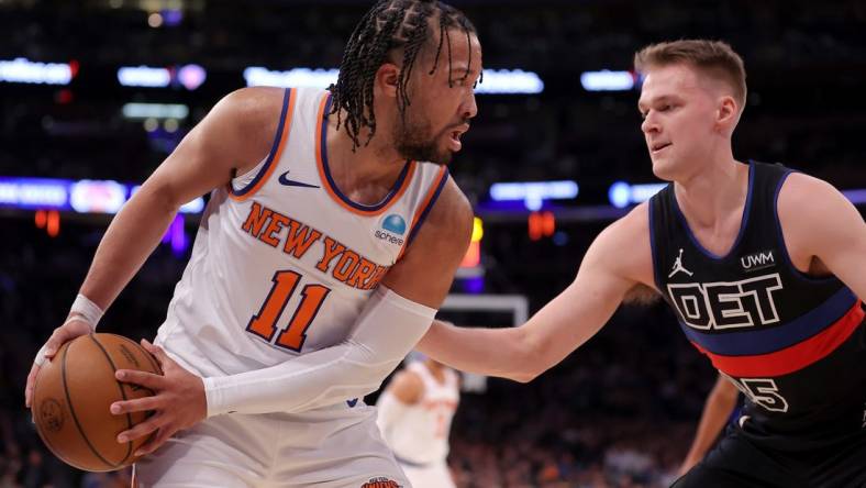 Mar 25, 2024; New York, New York, USA; New York Knicks guard Jalen Brunson (11) controls the ball against Detroit Pistons forward Buddy Boeheim (35) during the second quarter at Madison Square Garden. Mandatory Credit: Brad Penner-USA TODAY Sports