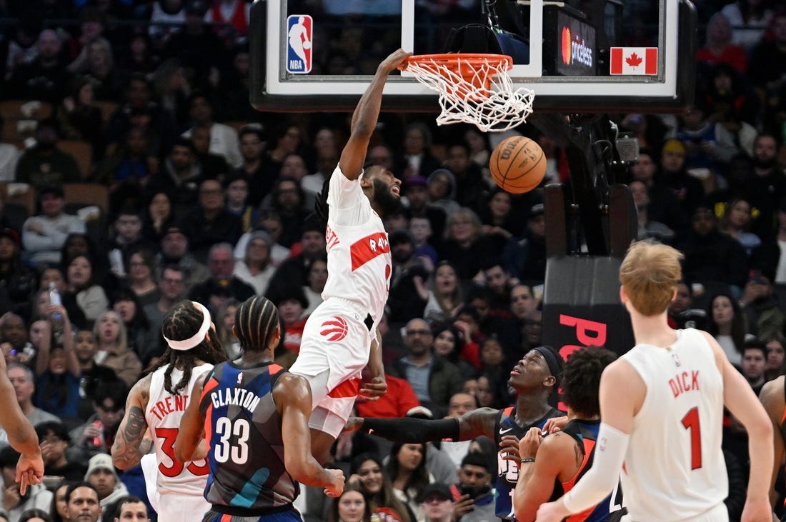 Mar 25, 2024; Toronto, Ontario, CAN;  Toronto Raptors guard Javon Freeman-Liberty (0) dunks against the Brooklyn Nets in the first half at Scotiabank Arena. Mandatory Credit: Dan Hamilton-USA TODAY Sports