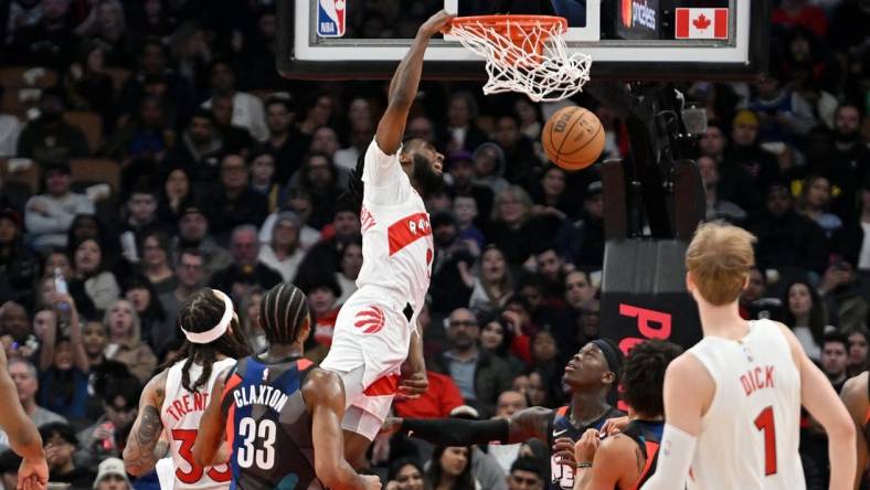 Mar 25, 2024; Toronto, Ontario, CAN;  Toronto Raptors guard Javon Freeman-Liberty (0) dunks against the Brooklyn Nets in the first half at Scotiabank Arena. Mandatory Credit: Dan Hamilton-USA TODAY Sports