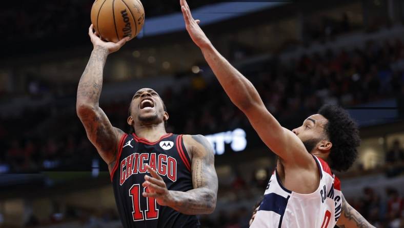 Mar 25, 2024; Chicago, Illinois, USA; Chicago Bulls forward DeMar DeRozan (11) goes to the basket against Washington Wizards forward Justin Champagnie (99) during the first half at United Center. Mandatory Credit: Kamil Krzaczynski-USA TODAY Sports