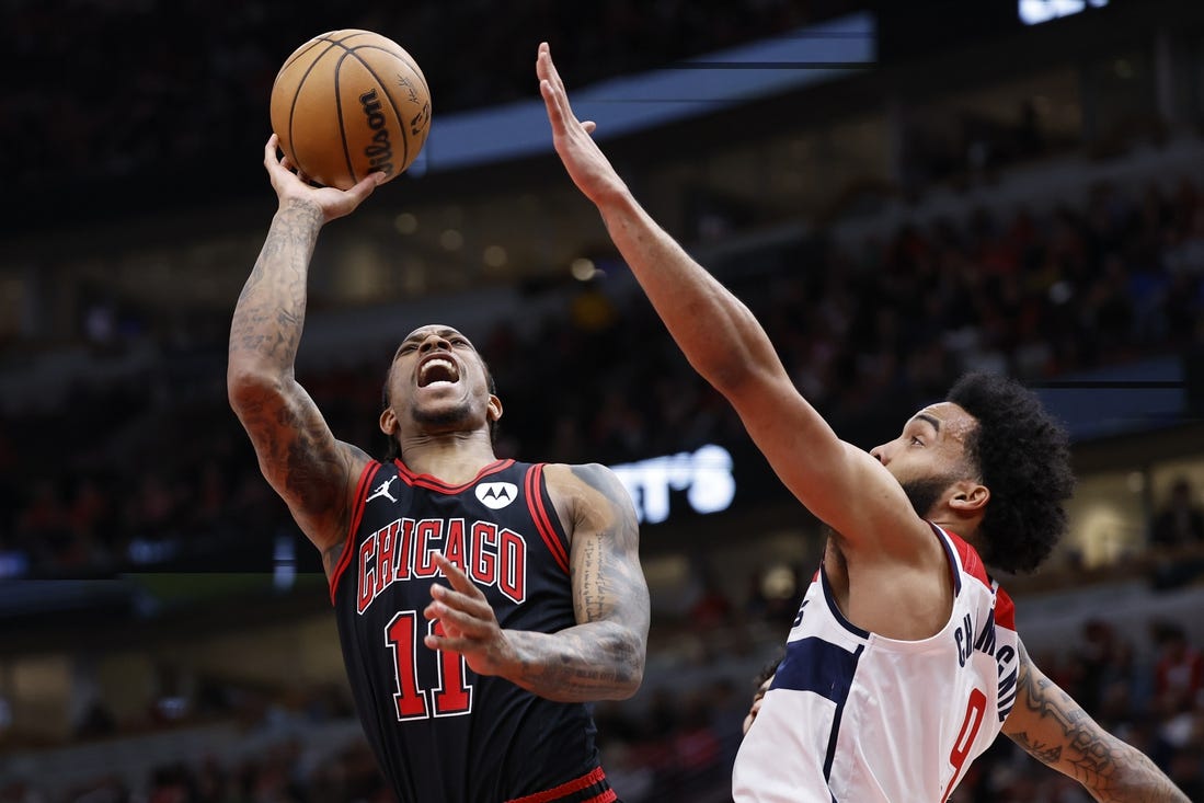 Mar 25, 2024; Chicago, Illinois, USA; Chicago Bulls forward DeMar DeRozan (11) goes to the basket against Washington Wizards forward Justin Champagnie (99) during the first half at United Center. Mandatory Credit: Kamil Krzaczynski-USA TODAY Sports