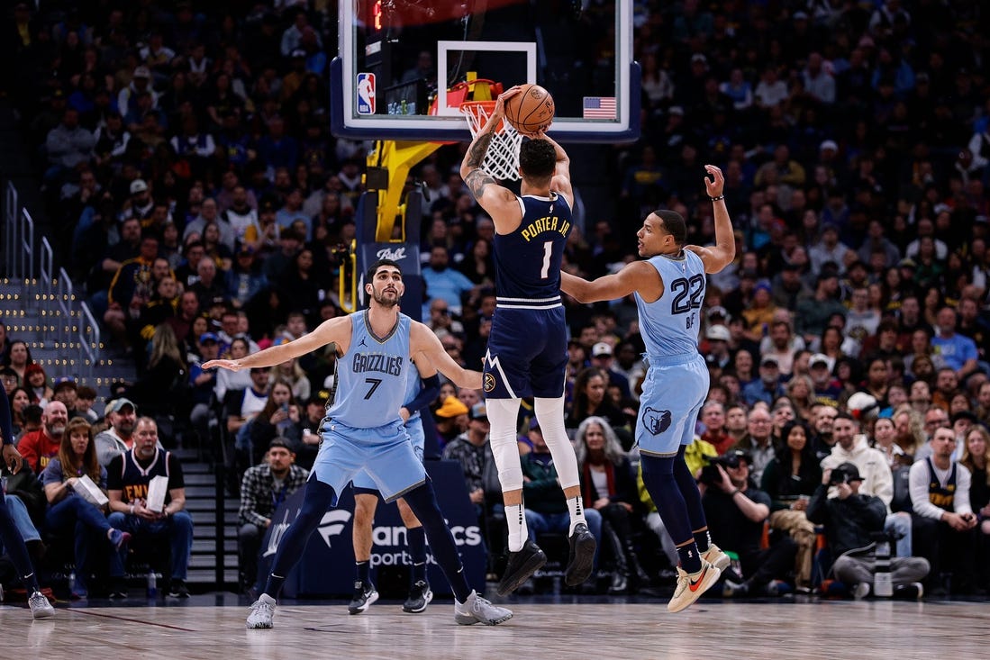 Mar 25, 2024; Denver, Colorado, USA; Denver Nuggets forward Michael Porter Jr. (1) attempts a three point shot against Memphis Grizzlies guard Desmond Bane (22) and forward Santi Aldama (7) in the first quarter at Ball Arena. Mandatory Credit: Isaiah J. Downing-USA TODAY Sports