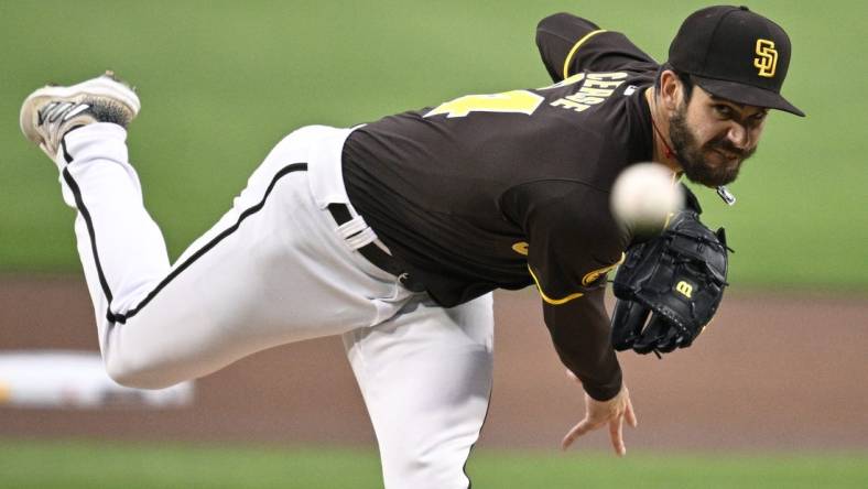 Mar 25, 2024; San Diego, California, USA; San Diego Padres starting pitcher Dylan Cease (84) throws a pitch against the Seattle Mariners during the first inning at Petco Park. Mandatory Credit: Orlando Ramirez-USA TODAY Sports