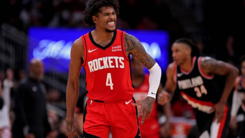 Mar 25, 2024; Houston, Texas, USA; Houston Rockets guard Jalen Green (4) reacts after a basket against the Portland Trail Blazers during the fourth quarter at Toyota Center. Mandatory Credit: Erik Williams-USA TODAY Sports