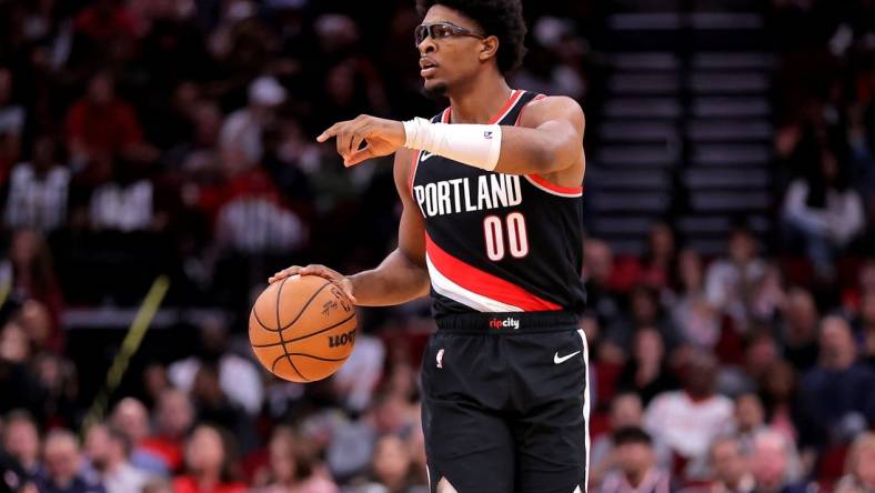 Mar 25, 2024; Houston, Texas, USA; Portland Trail Blazers guard Scoot Henderson (00) handles the ball against the Houston Rockets during the fourth quarter at Toyota Center. Mandatory Credit: Erik Williams-USA TODAY Sports