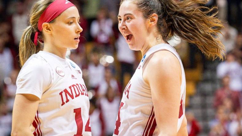 Indiana's Mackenzie Holmes (54) celebrates with Sara Scalia (14) after the fourth quarter during second round NCAA action at Simon Skjodt Assembly Hall on Monday, March 25, 2024.