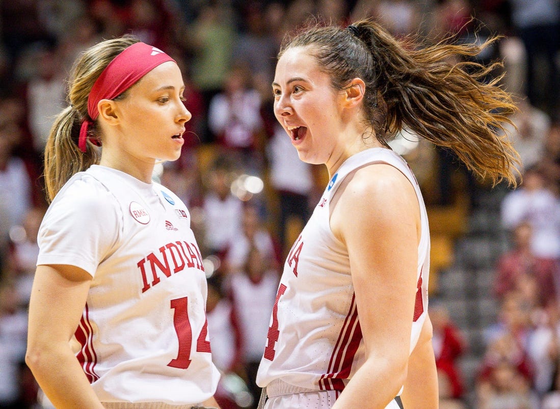 Indiana's Mackenzie Holmes (54) celebrates with Sara Scalia (14) after the fourth quarter during second round NCAA action at Simon Skjodt Assembly Hall on Monday, March 25, 2024.