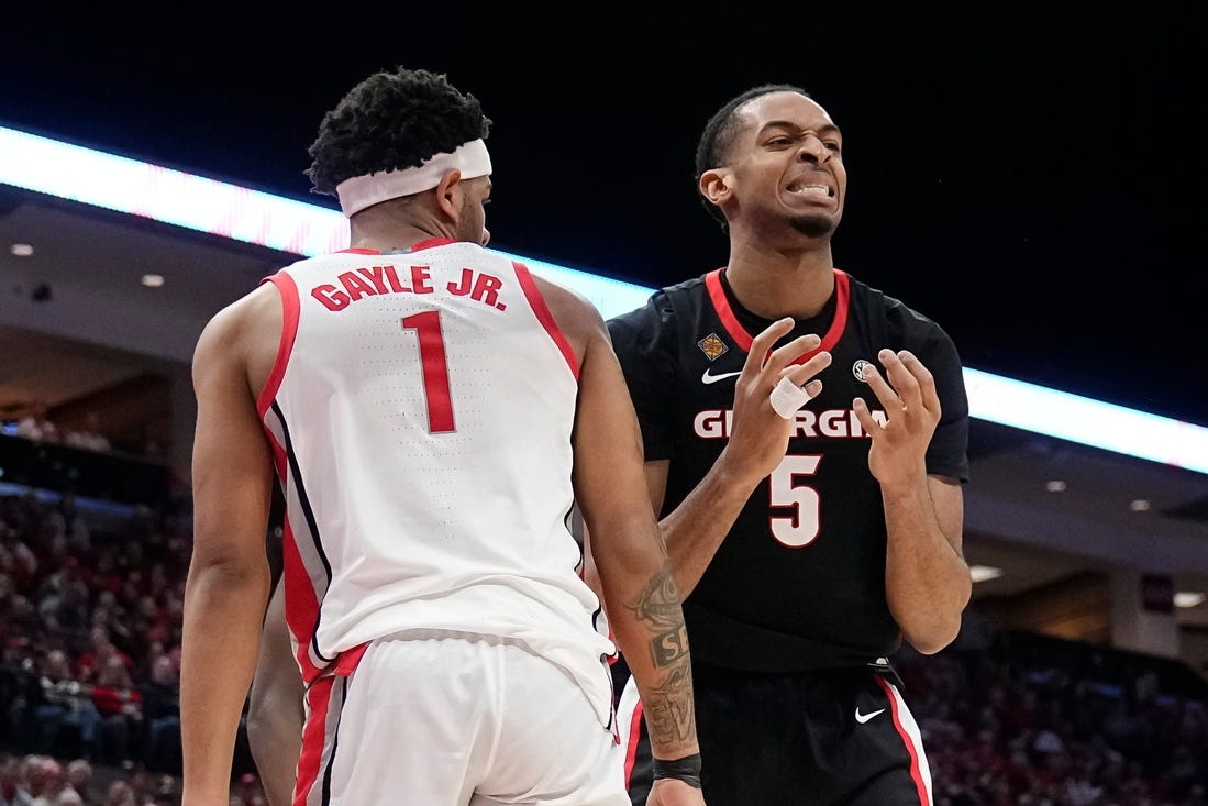 Mar 26, 2024; Columbus, OH, USA; Georgia Bulldogs center Frank Anselem-Ibe (5) reacts to a missed rebound beside Ohio State Buckeyes guard Roddy Gayle Jr. (1) during the first half of the NIT quarterfinals at Value City Arena.