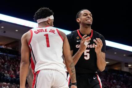 Mar 26, 2024; Columbus, OH, USA; Georgia Bulldogs center Frank Anselem-Ibe (5) reacts to a missed rebound beside Ohio State Buckeyes guard Roddy Gayle Jr. (1) during the first half of the NIT quarterfinals at Value City Arena.