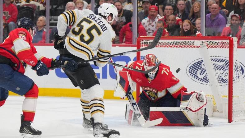 Mar 26, 2024; Sunrise, Florida, USA; Boston Bruins right wing Justin Brazeau (55) takes a shot on goal as Florida Panthers goaltender Sergei Bobrovsky (72) makes a save in the first period at Amerant Bank Arena. Mandatory Credit: Jim Rassol-USA TODAY Sports