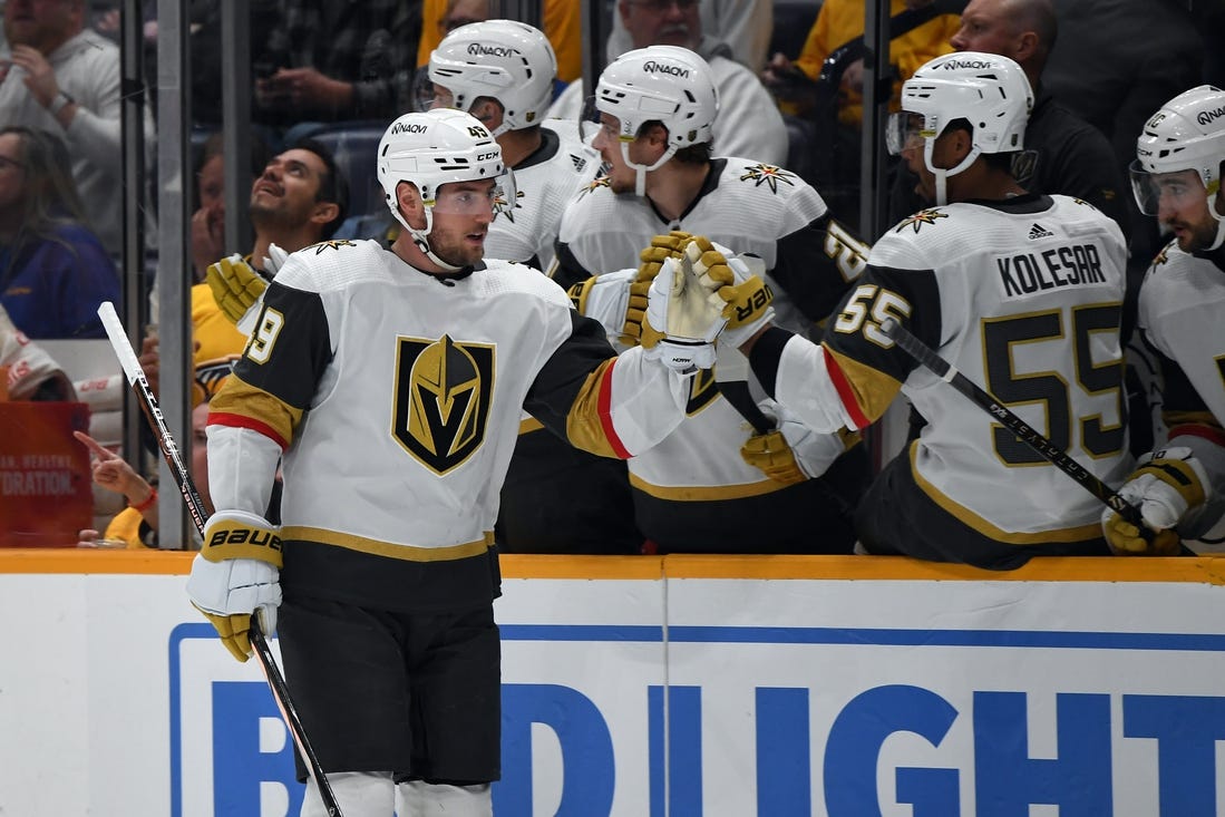 Mar 26, 2024; Nashville, Tennessee, USA; Vegas Golden Knights center Ivan Barbashev (49) celebrates with teammates after a goal during the first period against the Nashville Predators at Bridgestone Arena. Mandatory Credit: Christopher Hanewinckel-USA TODAY Sports