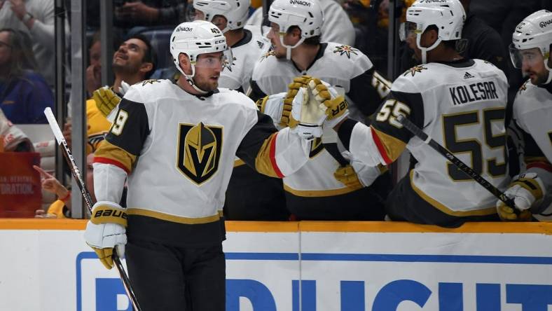 Mar 26, 2024; Nashville, Tennessee, USA; Vegas Golden Knights center Ivan Barbashev (49) celebrates with teammates after a goal during the first period against the Nashville Predators at Bridgestone Arena. Mandatory Credit: Christopher Hanewinckel-USA TODAY Sports