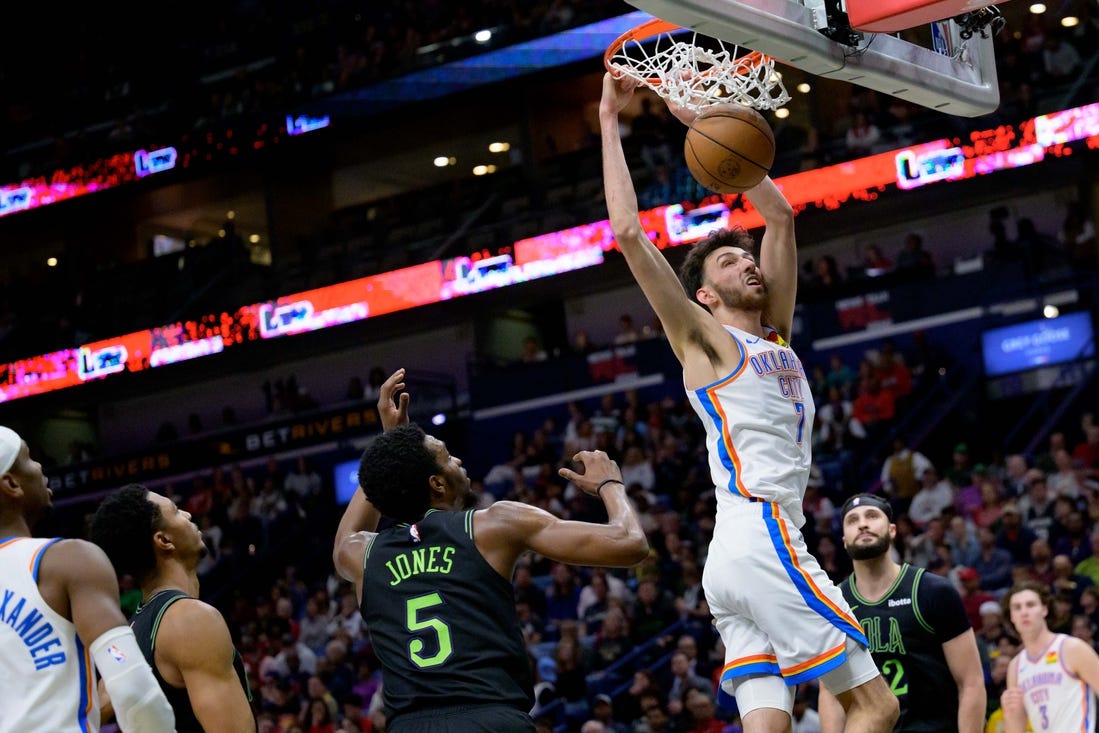 Mar 26, 2024; New Orleans, Louisiana, USA; Oklahoma City Thunder forward Chet Holmgren (7) dunks against New Orleans Pelicans forward Herbert Jones (5) during the first half at Smoothie King Center. Mandatory Credit: Matthew Hinton-USA TODAY Sports