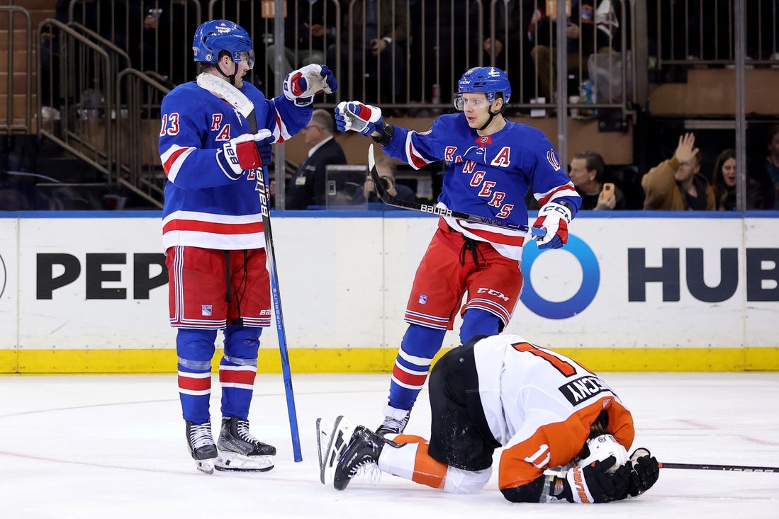 Mar 26, 2024; New York, New York, USA; New York Rangers left wing Alexis Lafreniere (13) celebrates his goal with left wing Artemi Panarin (10) in front of Philadelphia Flyers right wing Travis Konecny (11) during the third period at Madison Square Garden. Mandatory Credit: Brad Penner-USA TODAY Sports