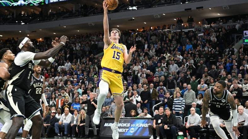 Mar 26, 2024; Milwaukee, Wisconsin, USA; Los Angeles Lakers guard Austin Reaves (15) drives to the basket in the second half at Fiserv Forum. Mandatory Credit: Michael McLoone-USA TODAY Sports