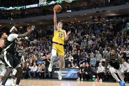 Mar 26, 2024; Milwaukee, Wisconsin, USA; Los Angeles Lakers guard Austin Reaves (15) drives to the basket in the second half at Fiserv Forum. Mandatory Credit: Michael McLoone-USA TODAY Sports