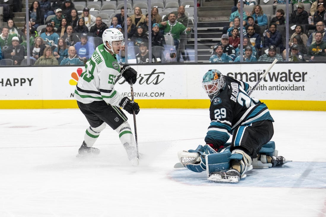 Mar 26, 2024; San Jose, California, USA; Dallas Stars center Wyatt Johnston (53) shoots and scores against San Jose Sharks goaltender Mackenzie Blackwood (29) during the first period at SAP Center at San Jose. Mandatory Credit: Neville E. Guard-USA TODAY Sports