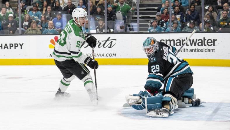 Mar 26, 2024; San Jose, California, USA; Dallas Stars center Wyatt Johnston (53) shoots and scores against San Jose Sharks goaltender Mackenzie Blackwood (29) during the first period at SAP Center at San Jose. Mandatory Credit: Neville E. Guard-USA TODAY Sports