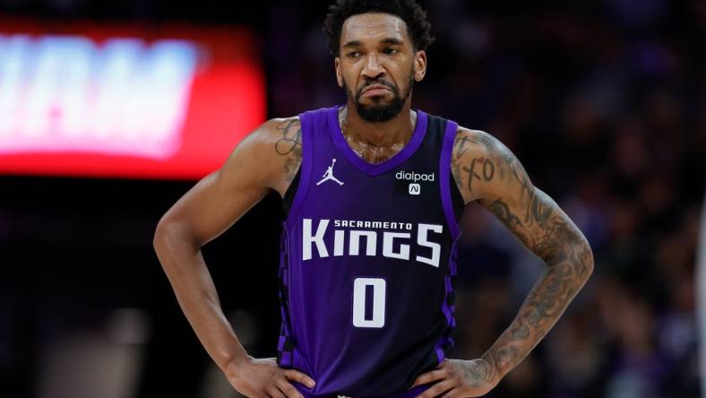 Mar 26, 2024; Sacramento, California, USA; Sacramento Kings guard Malik Monk (0) looks on during the fourth quarter against the Dallas Mavericks at Golden 1 Center. Mandatory Credit: Sergio Estrada-USA TODAY Sports