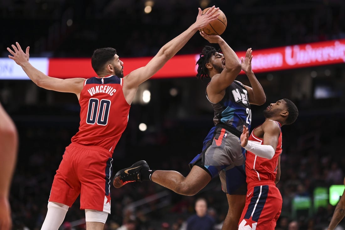 Mar 27, 2024; Washington, District of Columbia, USA;  Washington Wizards forward Tristan Vukcevic (00) blocks Brooklyn Nets guard Cam Thomas (24) shot during the first half at Capital One Arena. Mandatory Credit: Tommy Gilligan-USA TODAY Sports