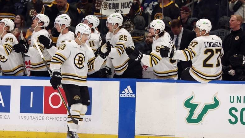 Mar 27, 2024; Tampa, Florida, USA; Boston Bruins left wing Danton Heinen (43) is congratulated after he scored a goal against the Tampa Bay Lightning during the first period at Amalie Arena. Mandatory Credit: Kim Klement Neitzel-USA TODAY Sports