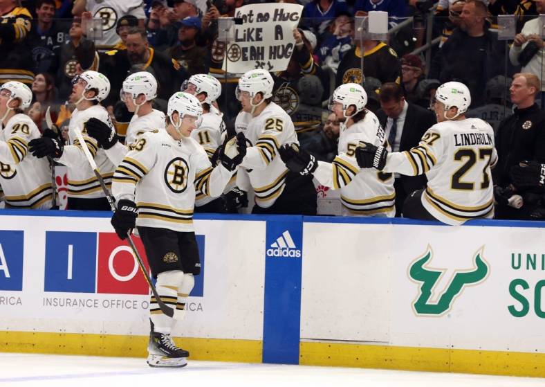 Mar 27, 2024; Tampa, Florida, USA; Boston Bruins left wing Danton Heinen (43) is congratulated after he scored a goal against the Tampa Bay Lightning during the first period at Amalie Arena. Mandatory Credit: Kim Klement Neitzel-USA TODAY Sports
