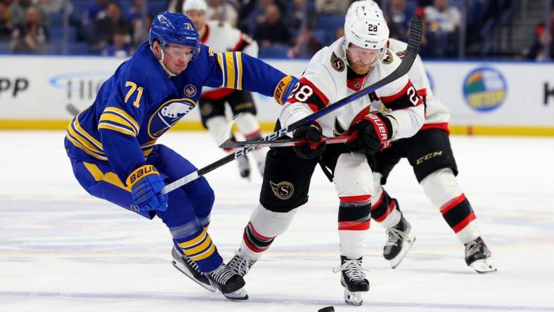 Mar 27, 2024; Buffalo, New York, USA;  Buffalo Sabres left wing Victor Olofsson (71) and Ottawa Senators right wing Claude Giroux (28) battle for a loose puck during the second period at KeyBank Center. Mandatory Credit: Timothy T. Ludwig-USA TODAY Sports