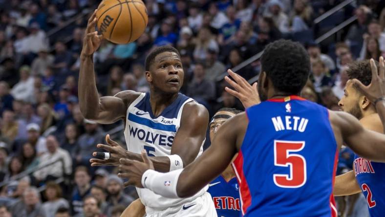 Mar 27, 2024; Minneapolis, Minnesota, USA; Minnesota Timberwolves guard Anthony Edwards (5) drives towards the basket and passes the ball against the Detroit Pistons in the first half at Target Center. Mandatory Credit: Jesse Johnson-USA TODAY Sports