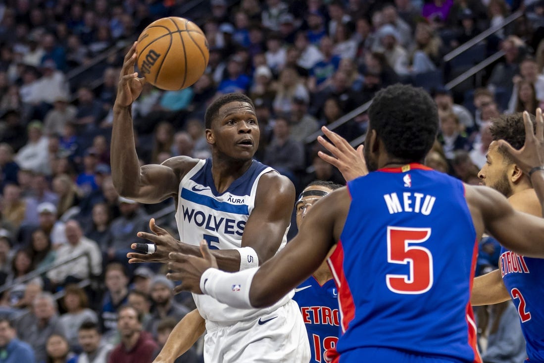 Mar 27, 2024; Minneapolis, Minnesota, USA; Minnesota Timberwolves guard Anthony Edwards (5) drives towards the basket and passes the ball against the Detroit Pistons in the first half at Target Center. Mandatory Credit: Jesse Johnson-USA TODAY Sports