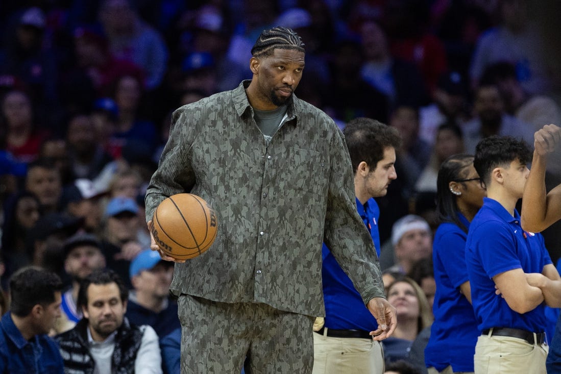 Mar 27, 2024; Philadelphia, Pennsylvania, USA; Injured Philadelphia 76ers center Joel Embiid dribbles the ball during a timeout in the second quarter against the LA Clippers at Wells Fargo Center. Mandatory Credit: Bill Streicher-USA TODAY Sports