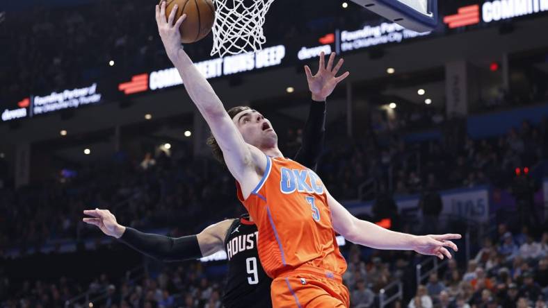 Mar 27, 2024; Oklahoma City, Oklahoma, USA; Oklahoma City Thunder guard Josh Giddey (3) shoots in front of Houston Rockets forward Dillon Brooks (9) during the second quarter at Paycom Center. Mandatory Credit: Alonzo Adams-USA TODAY Sports