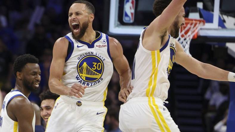 Mar 27, 2024; Orlando, Florida, USA;  Golden State Warriors guard Stephen Curry (30) celebrates with guard Klay Thompson (11) after beating the Orlando Magic at the Kia Center. Mandatory Credit: Nathan Ray Seebeck-USA TODAY Sports