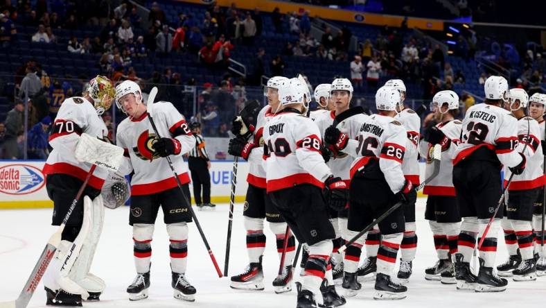 Mar 27, 2024; Buffalo, New York, USA;  The Ottawa Senators celebrate a win over the Buffalo Sabres at KeyBank Center. Mandatory Credit: Timothy T. Ludwig-USA TODAY Sports