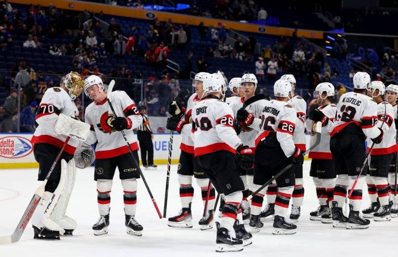 Mar 27, 2024; Buffalo, New York, USA;  The Ottawa Senators celebrate a win over the Buffalo Sabres at KeyBank Center. Mandatory Credit: Timothy T. Ludwig-USA TODAY Sports
