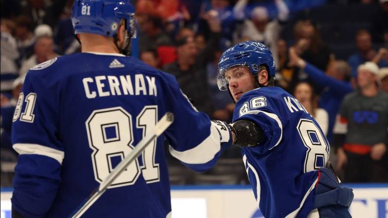 Mar 27, 2024; Tampa, Florida, USA; Tampa Bay Lightning right wing Nikita Kucherov (86) is congratulated after he scored a goal against the Boston Bruins during the third period at Amalie Arena. Mandatory Credit: Kim Klement Neitzel-USA TODAY Sports