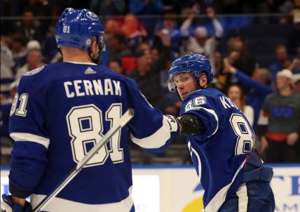 Mar 27, 2024; Tampa, Florida, USA; Tampa Bay Lightning right wing Nikita Kucherov (86) is congratulated after he scored a goal against the Boston Bruins during the third period at Amalie Arena. Mandatory Credit: Kim Klement Neitzel-USA TODAY Sports