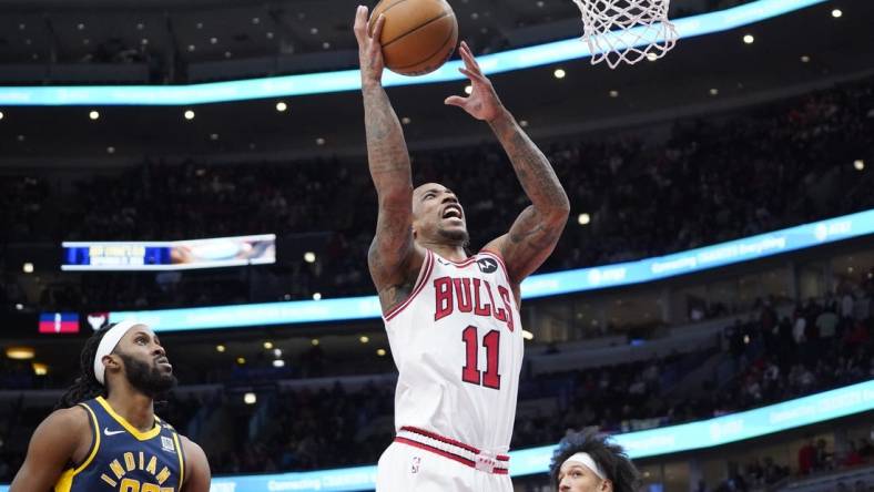 Mar 27, 2024; Chicago, Illinois, USA; Chicago Bulls forward DeMar DeRozan (11) is defended by Indiana Pacers forward Isaiah Jackson (22) during the second half at United Center. Mandatory Credit: David Banks-USA TODAY Sports